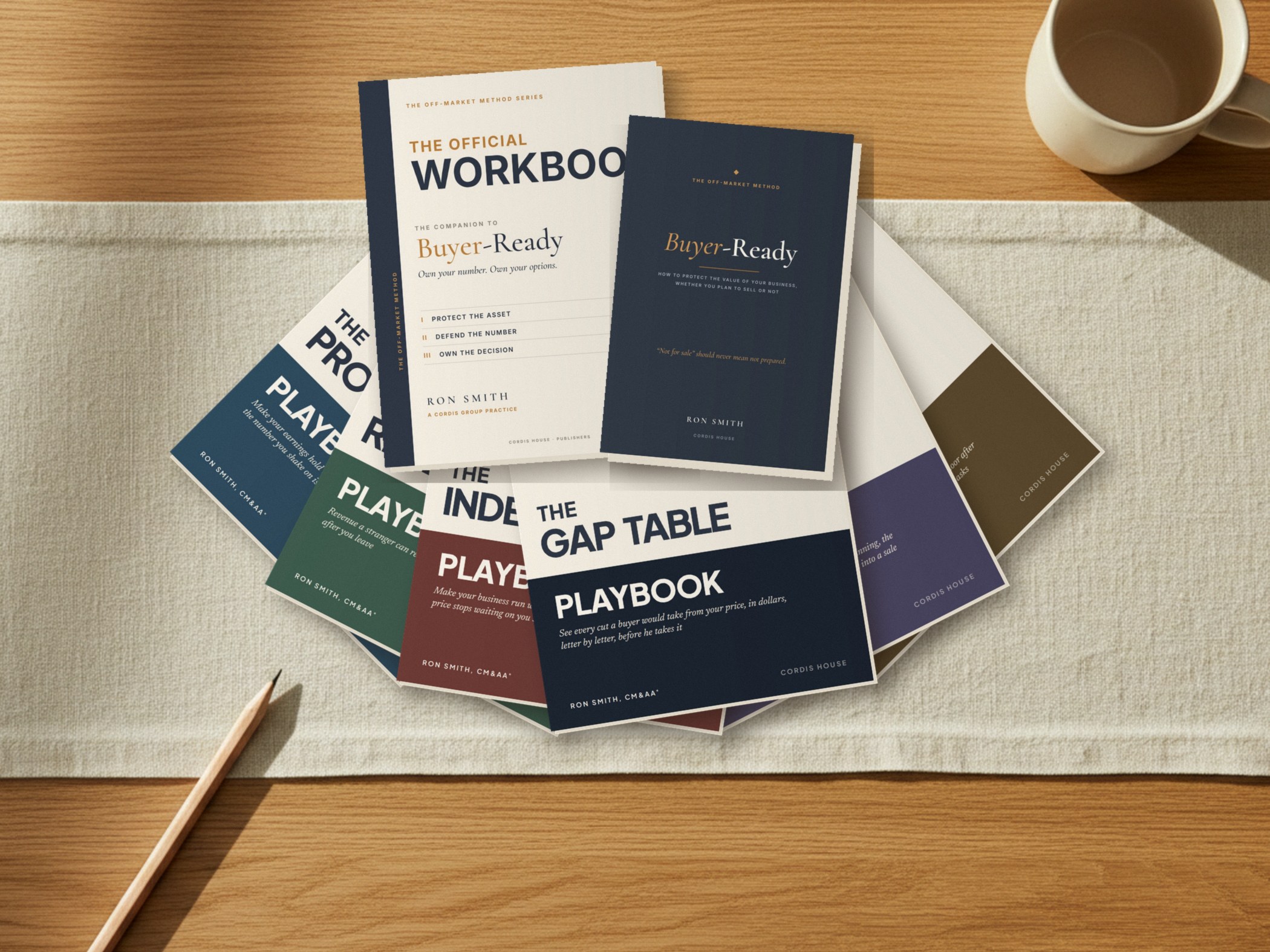 The six Buyer-Ready Playbooks fanned out on a table, with the Official Workbook and the Buyer-Ready paperback on top